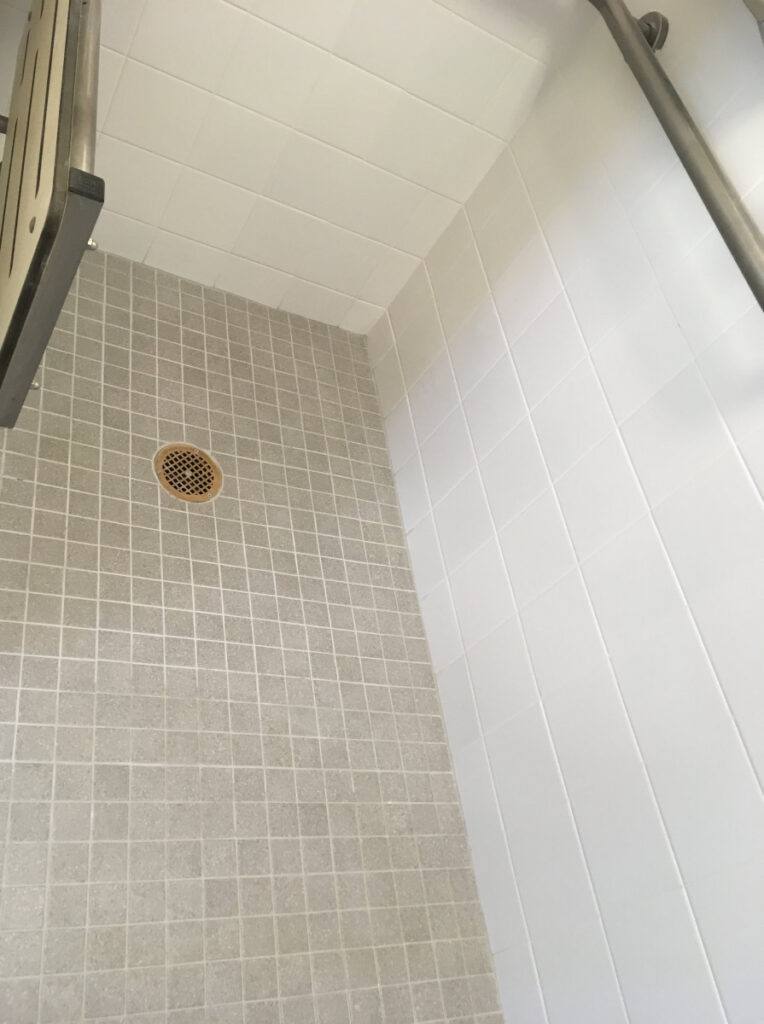 Commercial shower tile & grout cleaning & sealing and re-grouting - before
