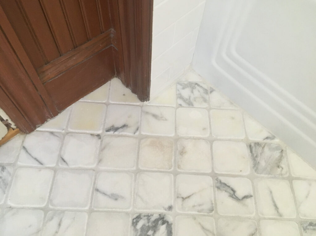 Stained marble tile cleaning, sealing and water damage repair - after image